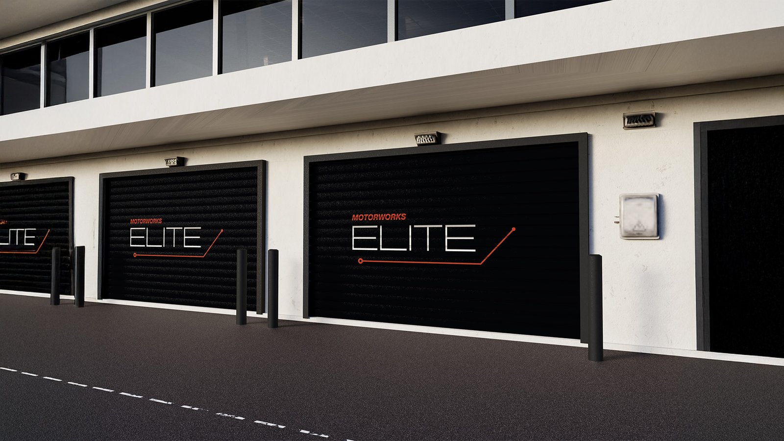Motorworks ELITE branded garage doors with modern black panels and bold logo design on white industrial building facade.