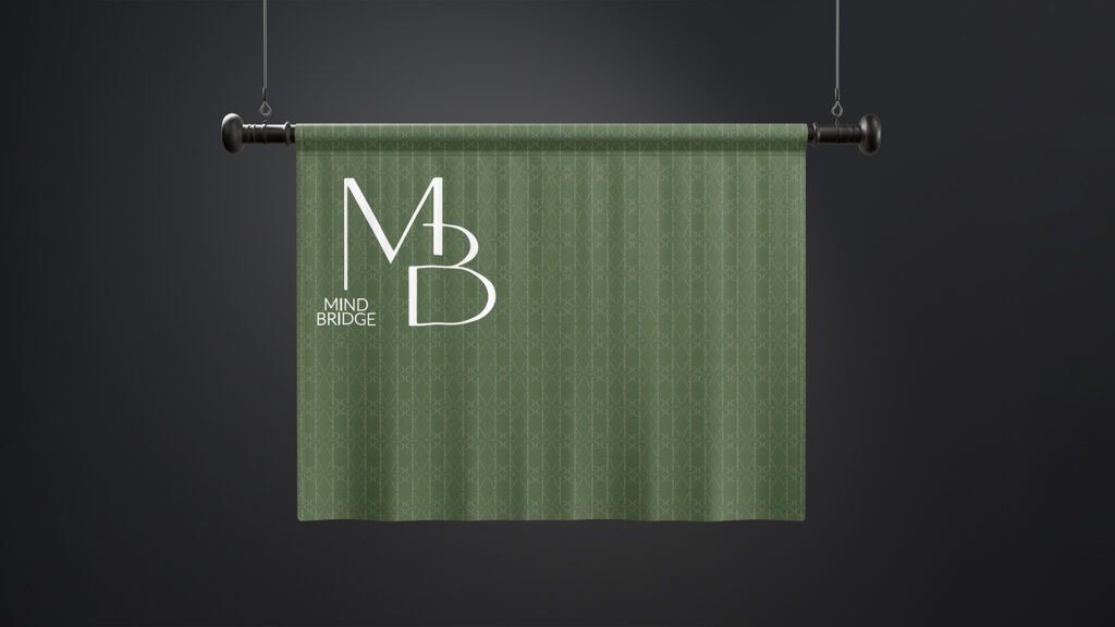 Green hanging banner with white "Mind Bridge" logo and MB monogram pattern, suspended against a dark background for elegant brand display.